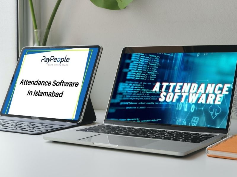 Professional team using digital attendance software in Islamabad on office laptop.